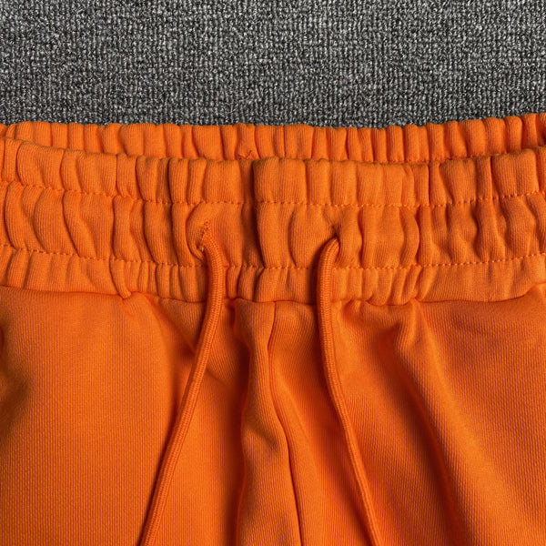 DENIM TEARS COTTON WREATH SWEATPANTS ORANGE